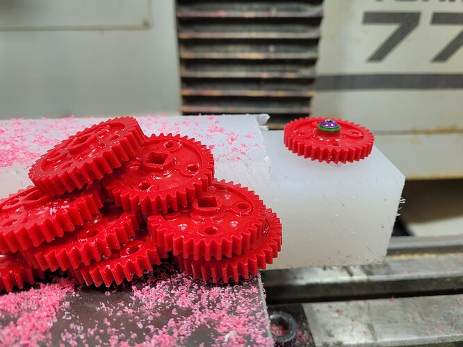 ligh strength gears in front of their machining setup